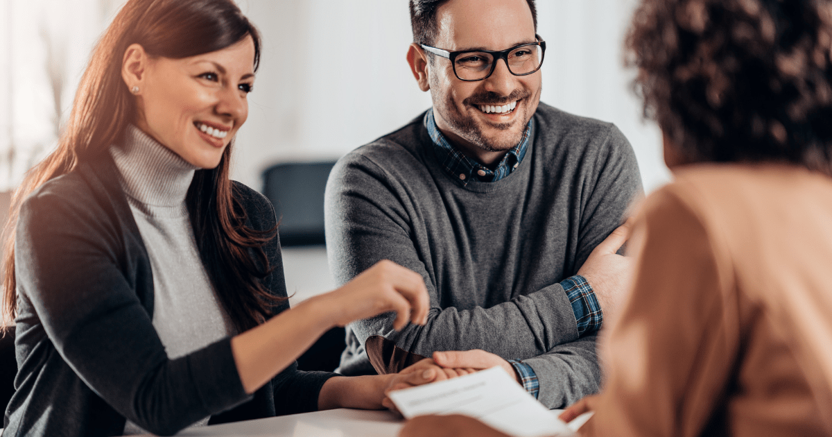 Happy clients talking with their attorney